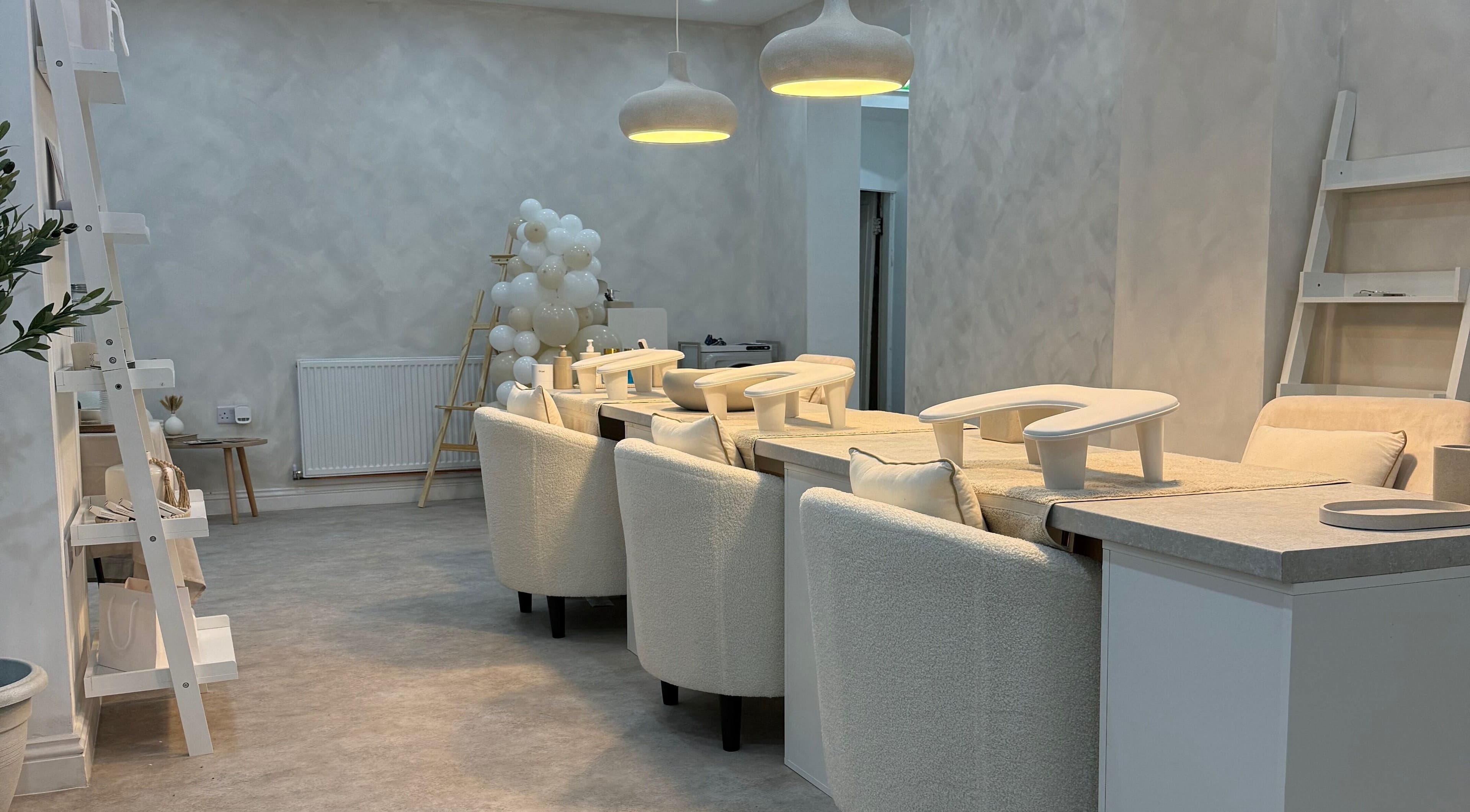 Modern beauty lounge area at Louise Butler Beauty, Kidsgrove, England, GB, with chic decor and soft lighting.