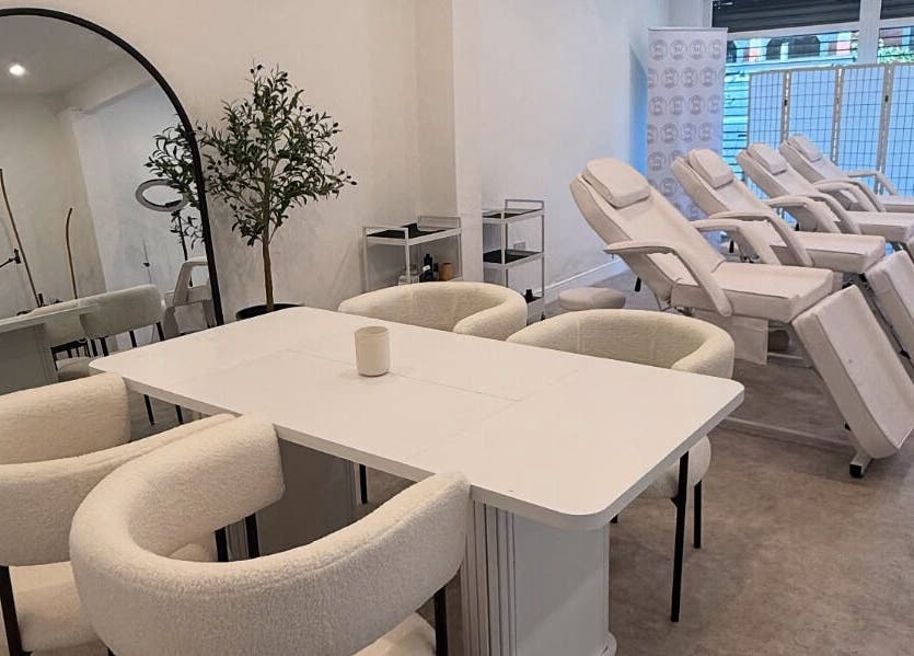 Modern beauty spa interior at Louise Butler Beauty, Kidsgrove, England, GB, featuring sleek white treatment chairs.