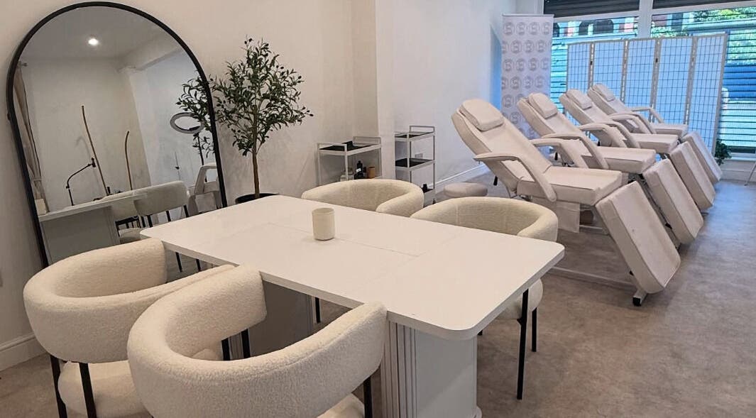 Modern beauty spa interior at Louise Butler Beauty, Kidsgrove, England, GB, featuring sleek white treatment chairs.