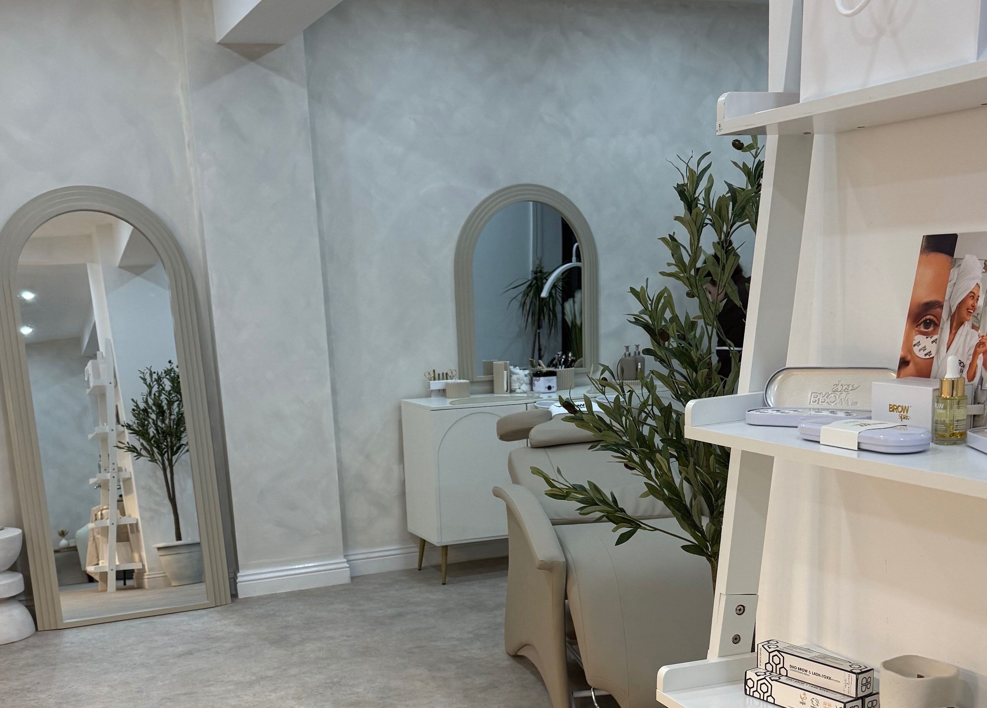 Elegant interior of Louise Butler Beauty in Kidsgrove, England with stylish decor and beauty products on display.