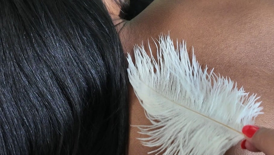 Calming feather massage at Sound, Mind and Bowl, Sidcup, England, GB promoting relaxation and tranquility.
