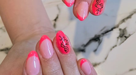 Bright pink nail art with flamingo design at Elle-Femme Beauty Treatments, St. Neots, England, GB.