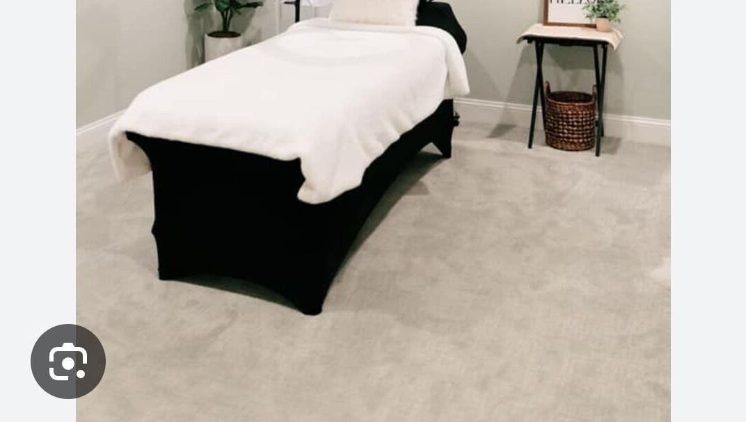 Luxurious spa treatment room at Lashedbypookie, Harare, Harare Province, ZW featuring a cozy massage table.