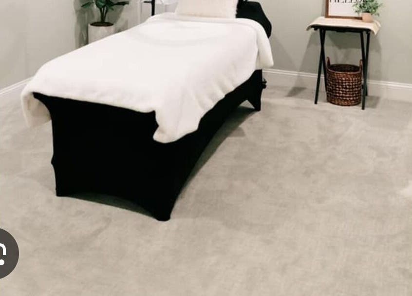 Luxurious spa treatment room at Lashedbypookie, Harare, Harare Province, ZW featuring a cozy massage table.