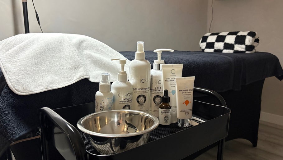 Serene skincare setup at The SKN Edit, Winsford, England, featuring premium products on a treatment table.