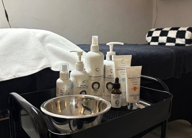 Serene skincare setup at The SKN Edit, Winsford, England, featuring premium products on a treatment table.
