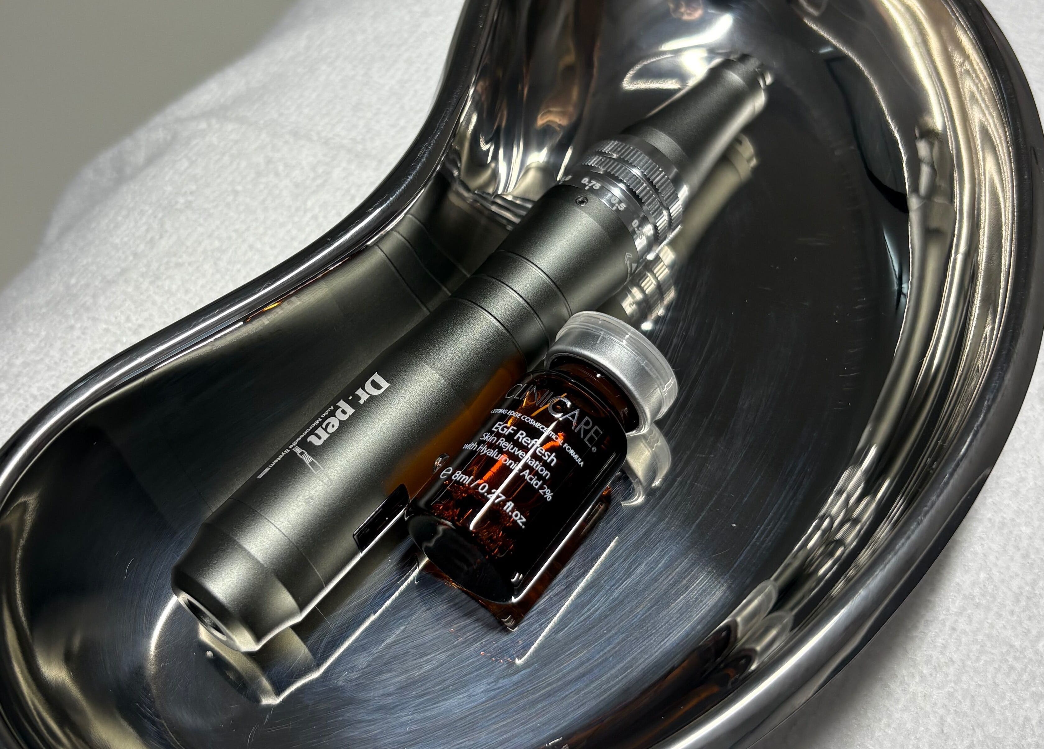 Dermapen with serum at The SKN Edit, Winsford, England, GB, showcasing beauty treatment tools.