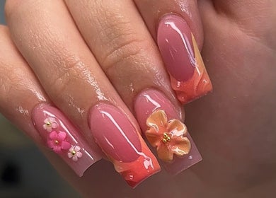 Intricate floral nail art at Clawed By Chey, Breda, Noord-brabant, NL showcasing detailed pink designs.