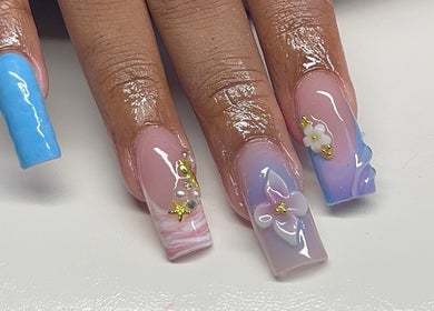 Beautifully designed nails with blue and pink floral art at Clawed By Chey, Breda, Noord-brabant, NL.