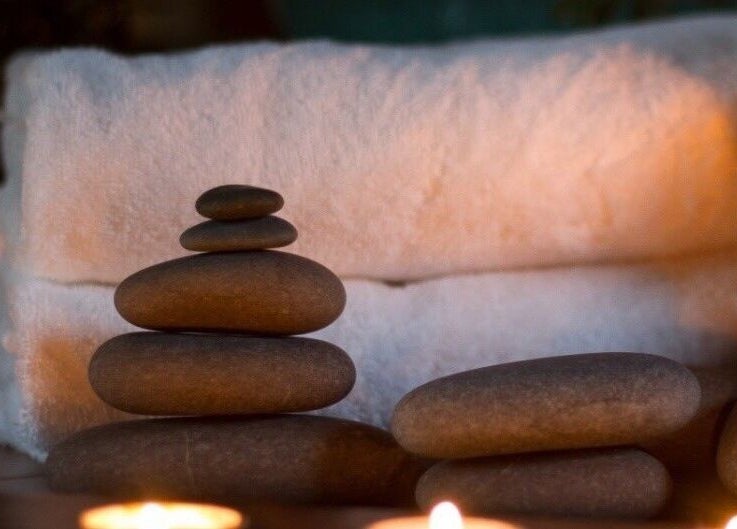 Elegant Touch Massage in Hughson, California offers soothing stone therapy for ultimate relaxation.
