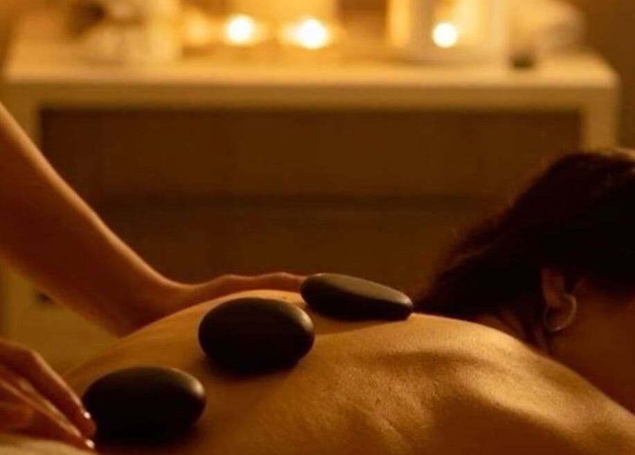 Relaxing hot stone massage at Elegant Touch Massage, Hughson, California, US, enhancing wellness and tranquility.