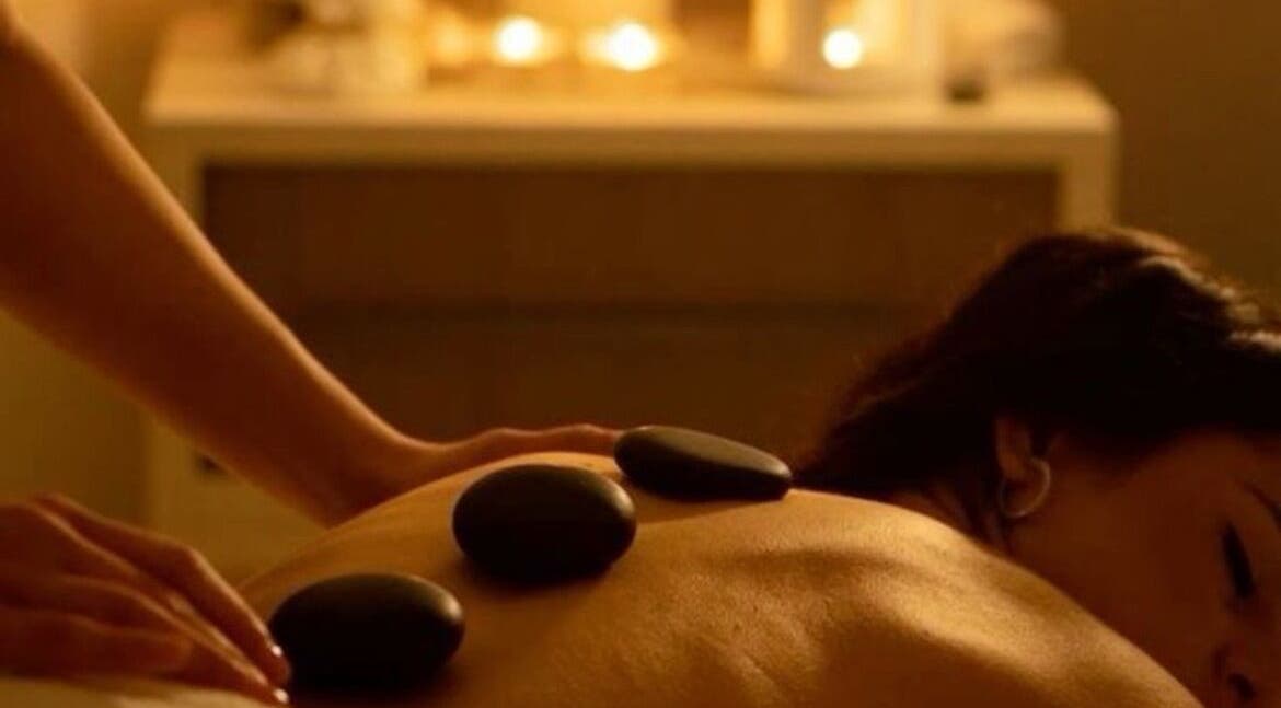 Relaxing hot stone massage at Elegant Touch Massage, Hughson, California, US, enhancing wellness and tranquility.