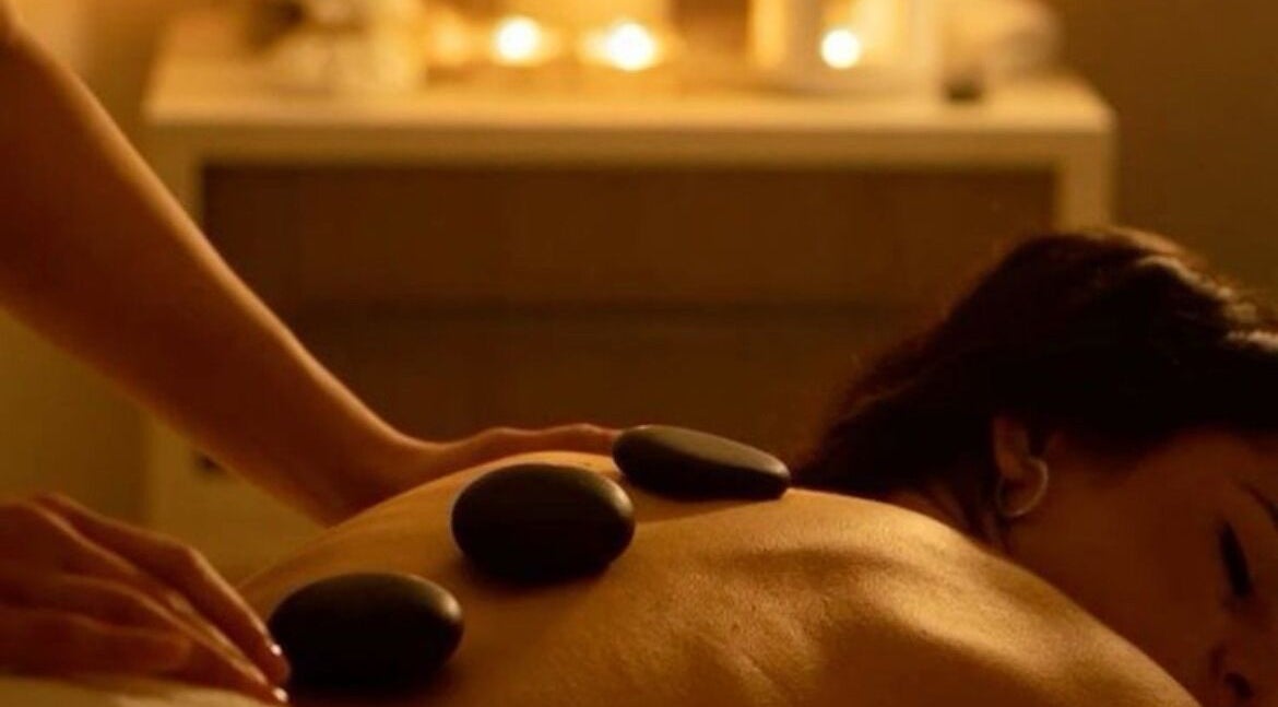 Relaxing hot stone massage at Elegant Touch Massage, Hughson, California, US, enhancing wellness and tranquility.