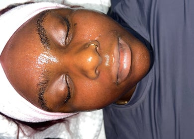 Relaxing facial treatment at NueElleMasion, London, England, GB. Woman enjoys a serene wellness experience.