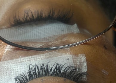 Close-up of eyelash extension treatment at NueElleMasion, London, England, GB, showcasing precision and artistry.
