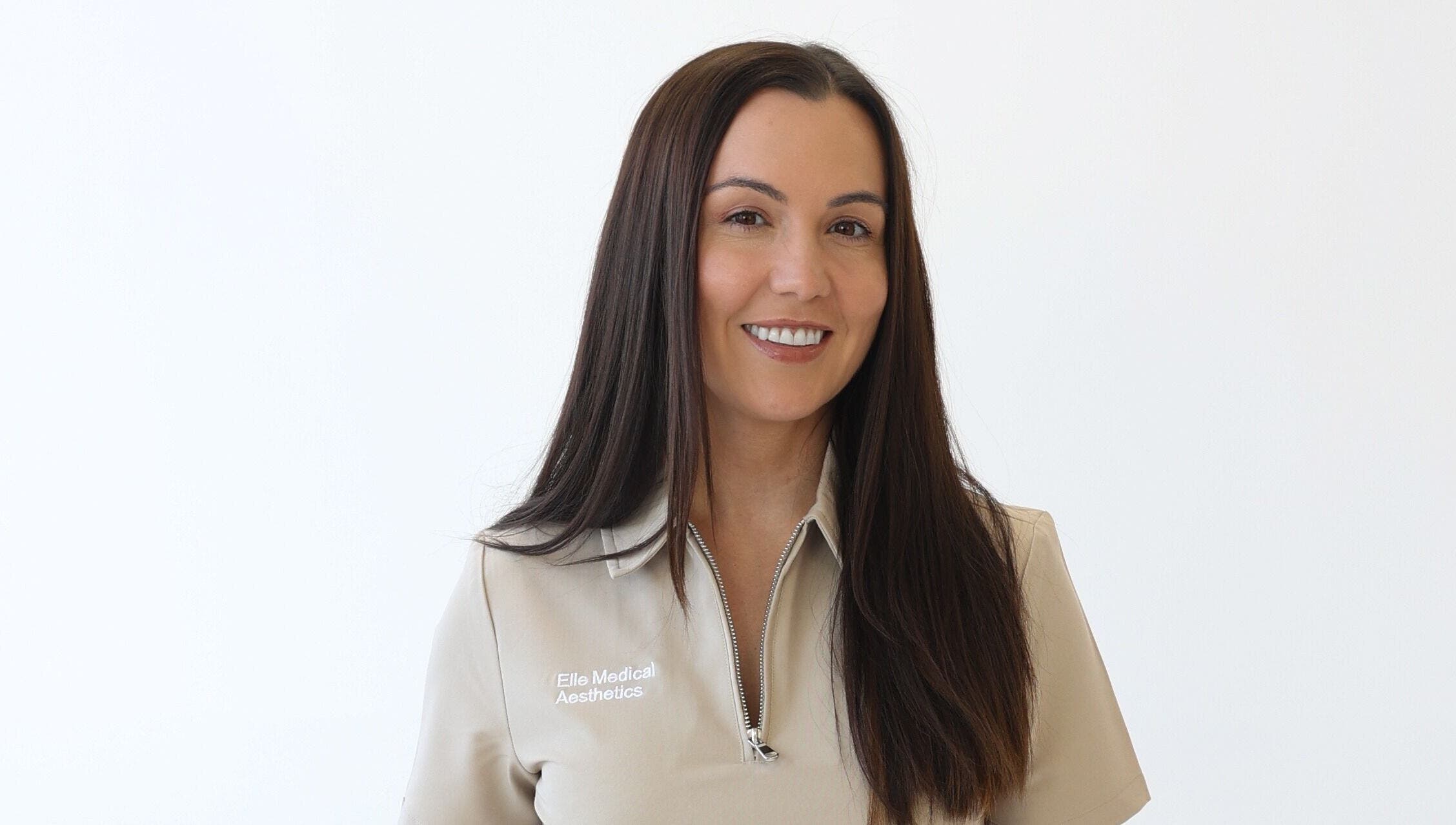 Professional at Elle Medical Aesthetics, Whittle-le-woods, England, GB smiling against a plain background.