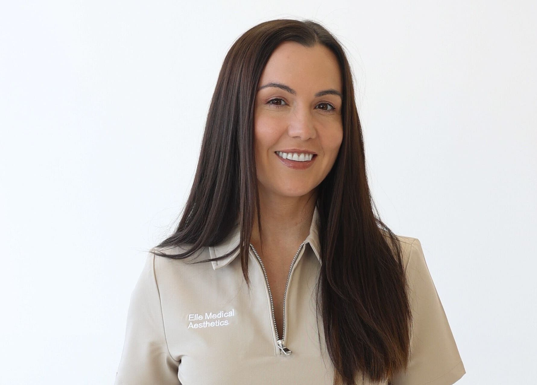 Professional at Elle Medical Aesthetics, Whittle-le-woods, England, GB smiling against a plain background.
