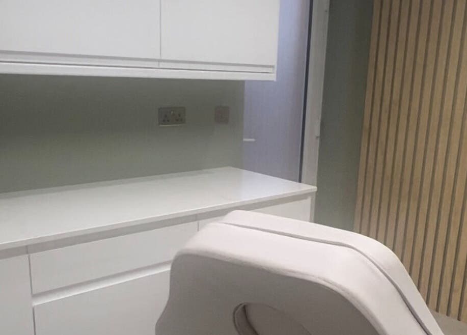 Modern treatment room at Elle Medical Aesthetics, Whittle-le-Woods, England, GB, featuring sleek white decor.