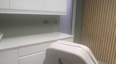 Modern treatment room at Elle Medical Aesthetics, Whittle-le-Woods, England, GB, featuring sleek white decor.