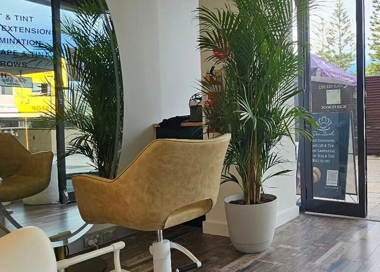 Elegant salon chair and mirror at Hair By Alina, Maroubra, New South Wales, AU, showcasing a relaxing ambiance.
