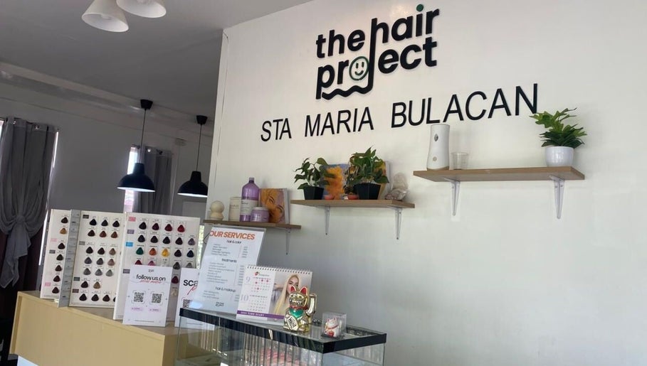 Stylish interior of Hair Project Salon in Santa Maria, Central Luzon, PH with decor and service details displayed.