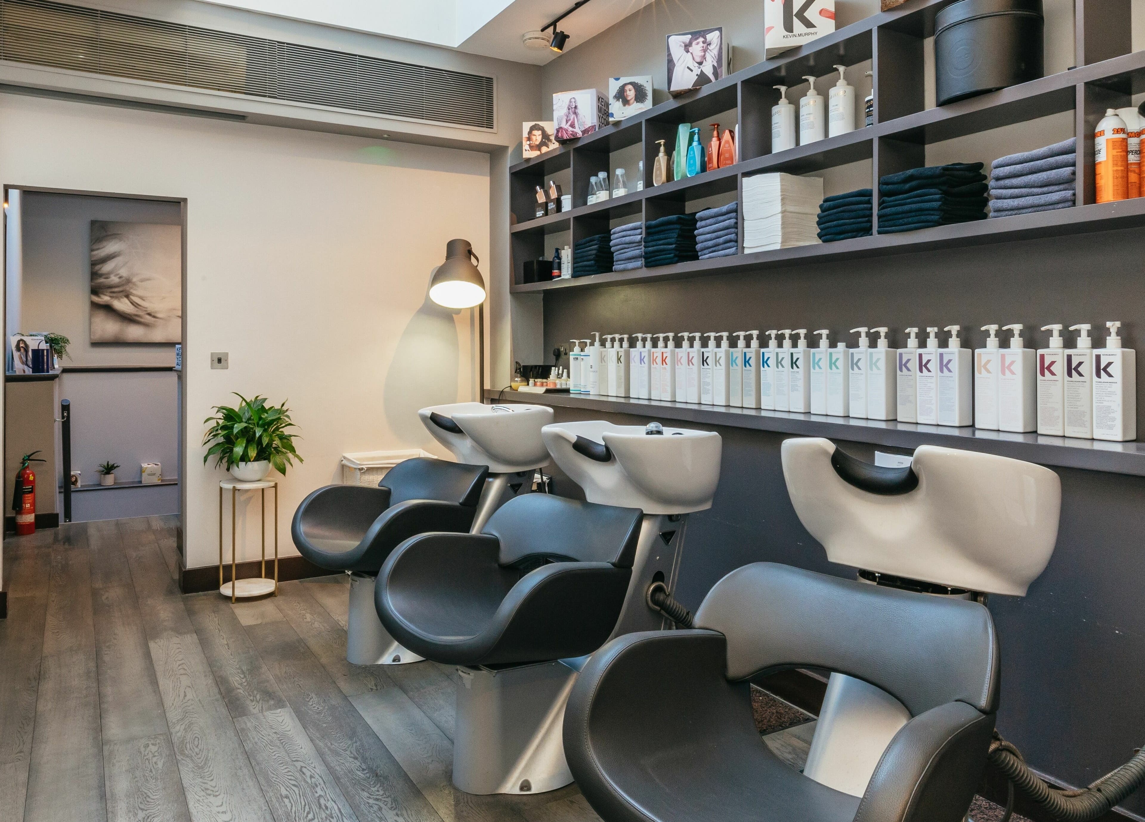 Modern salon chairs and products at Decadence Hair and Beauty, London, England, GB.