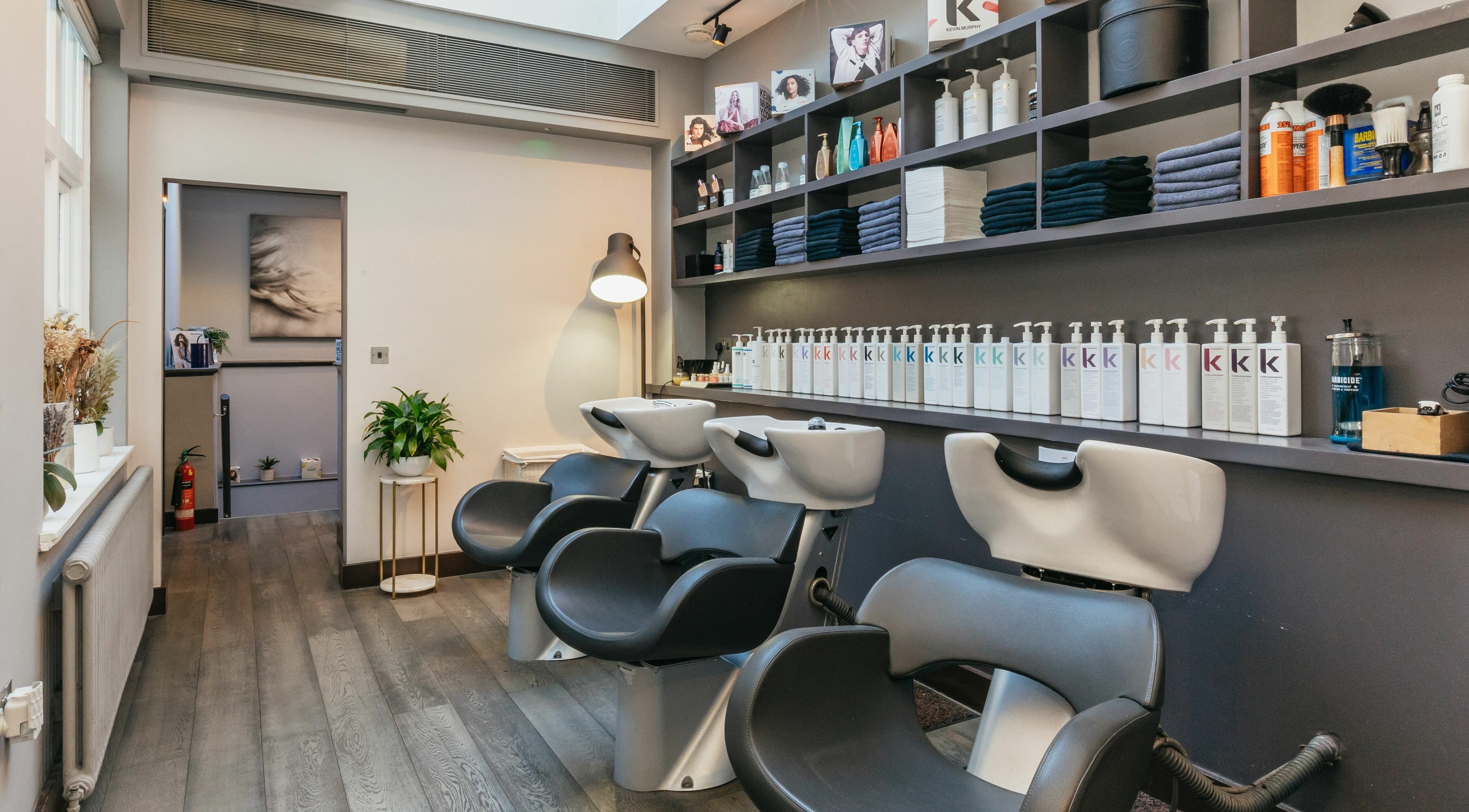 Modern salon chairs and products at Decadence Hair and Beauty, London, England, GB.