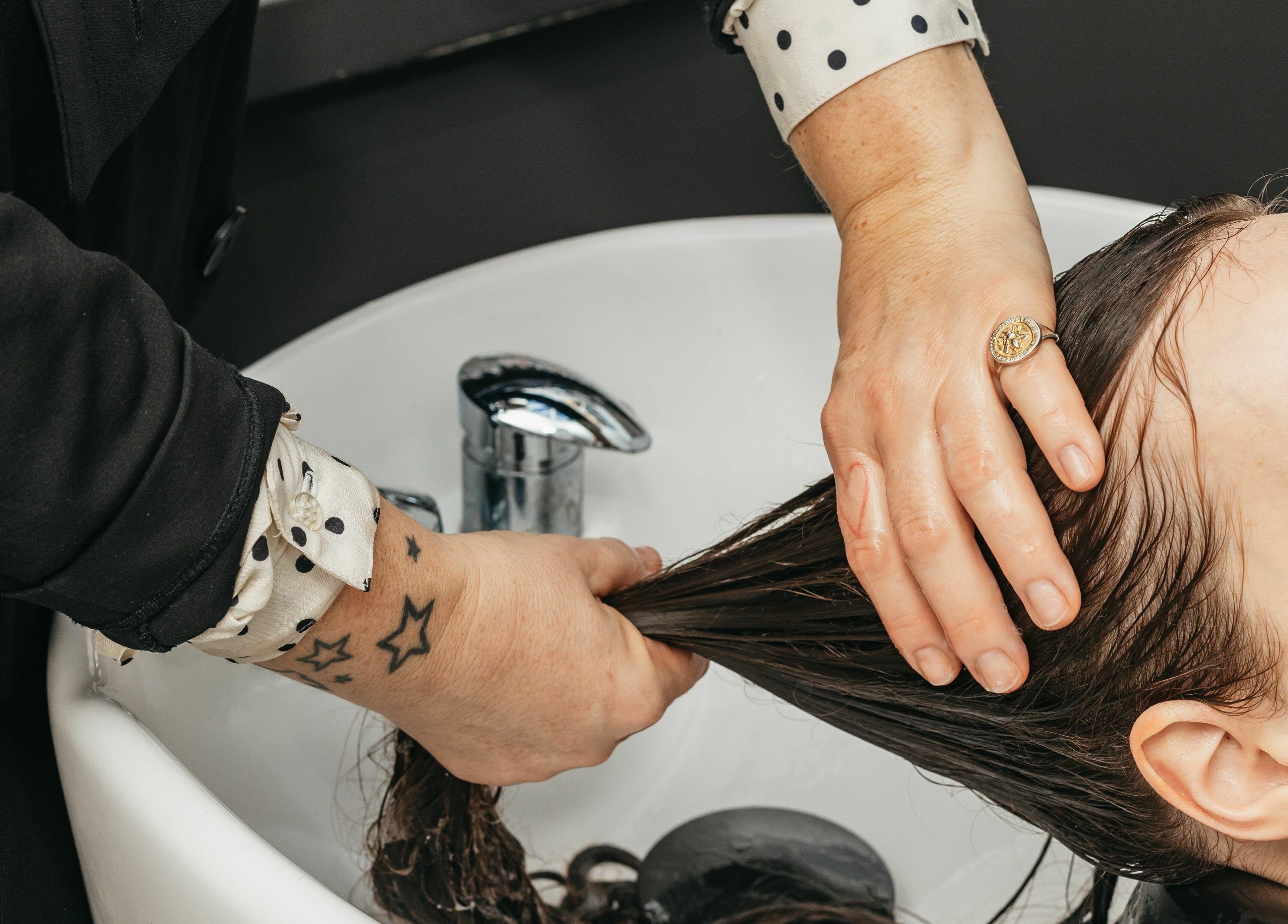 Relaxing hair wash at Decadence Hair and Beauty, London, England, GB, offering premium salon experiences.