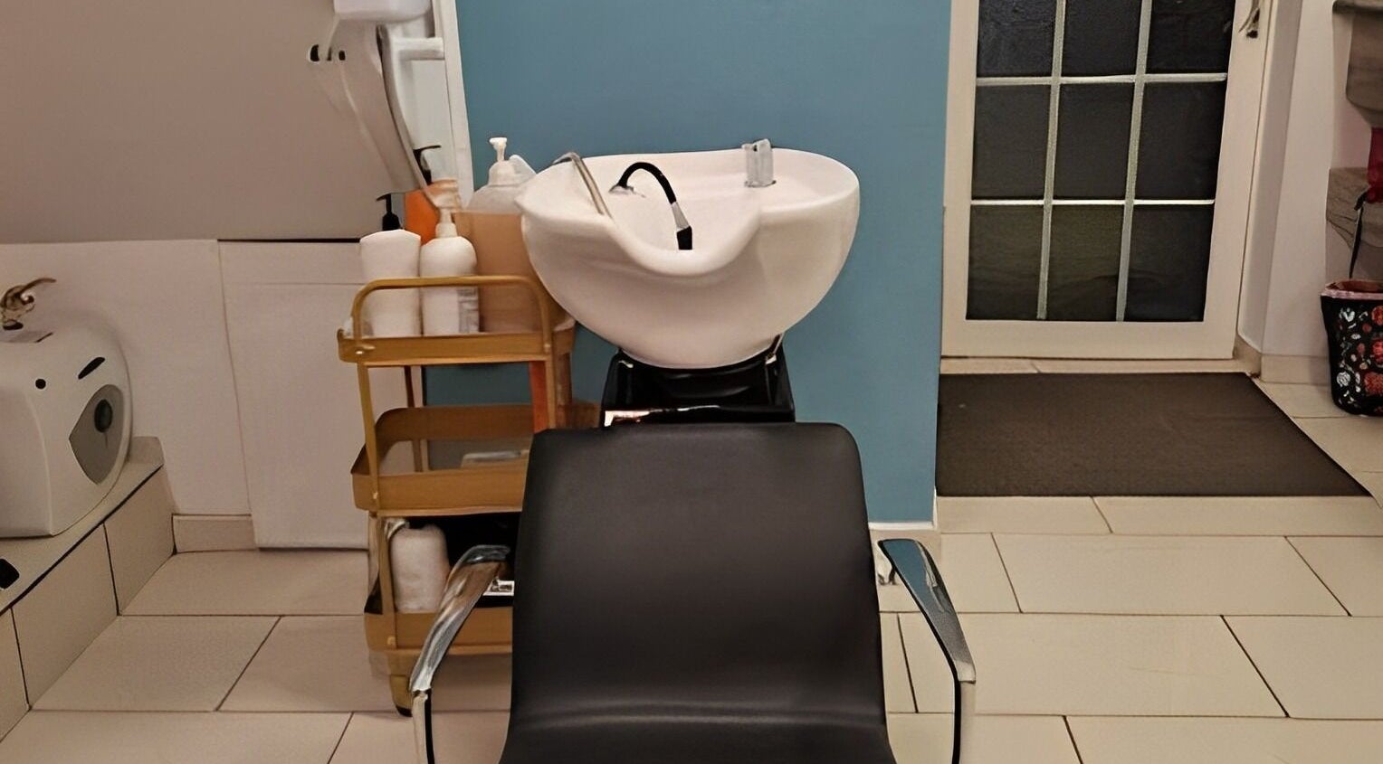 Hair washing station at A.D.A Salon Clonmel, Clonmel, County Tipperary, IE, showcasing sleek modern design.