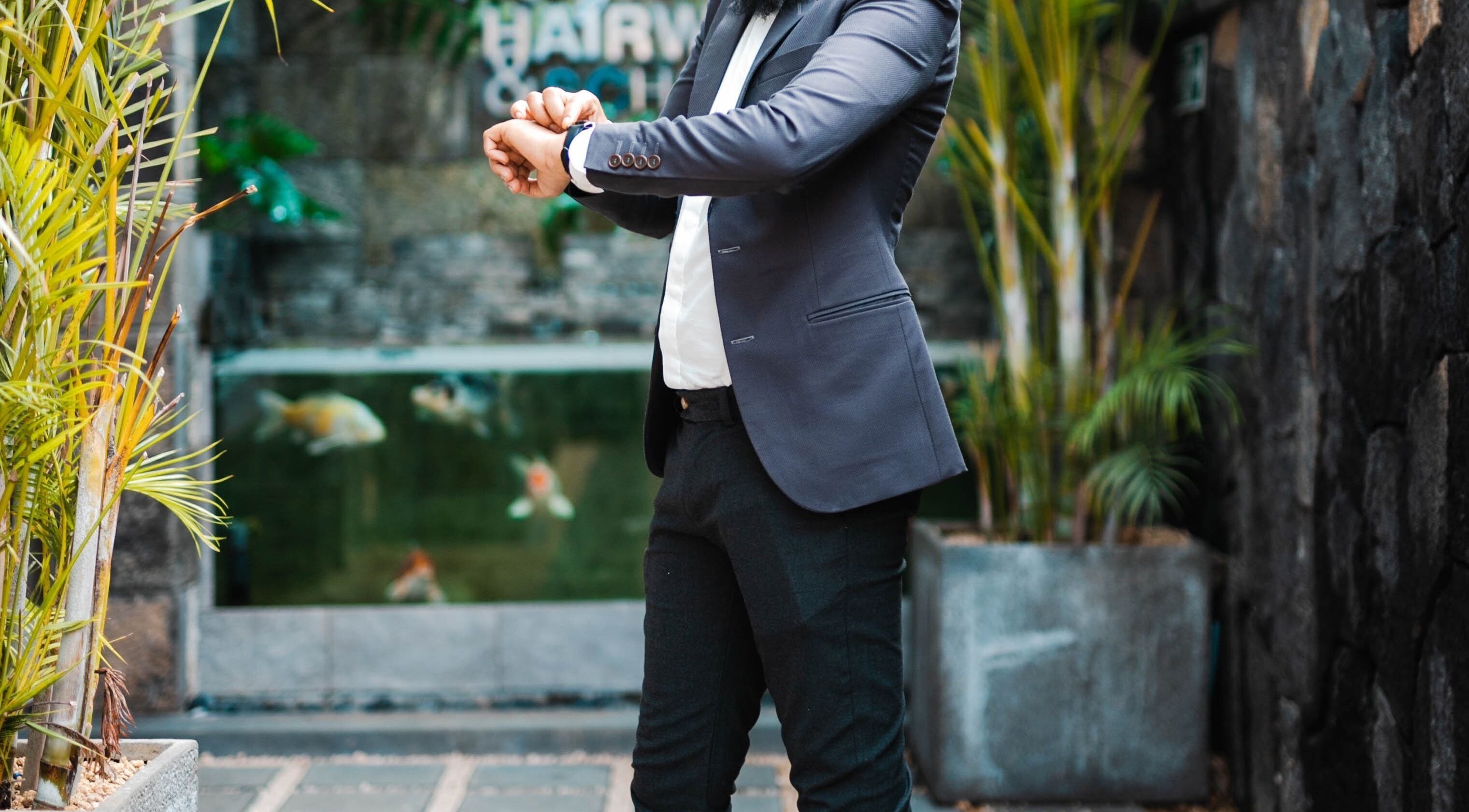 Man in suit outside Ashfaq Hair Studio, Beau Bassin-rose Hill, Plaines Wilhems District, MU.