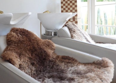 Cozy hair washing stations at Chere Cherie in Christchurch, Canterbury Region, NZ with plush fur covers.