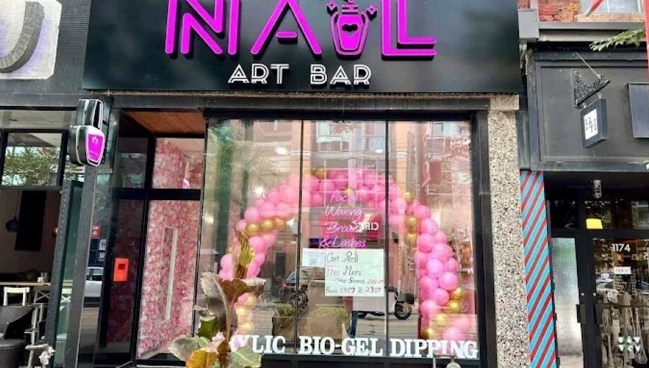 Nail Art Bar storefront with pink balloons in Toronto, Ontario, CA.