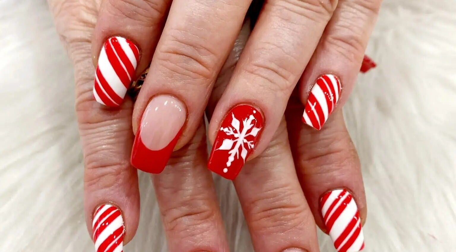 Festive red and white nail design at Nail Art Bar, Toronto, Ontario, CA.