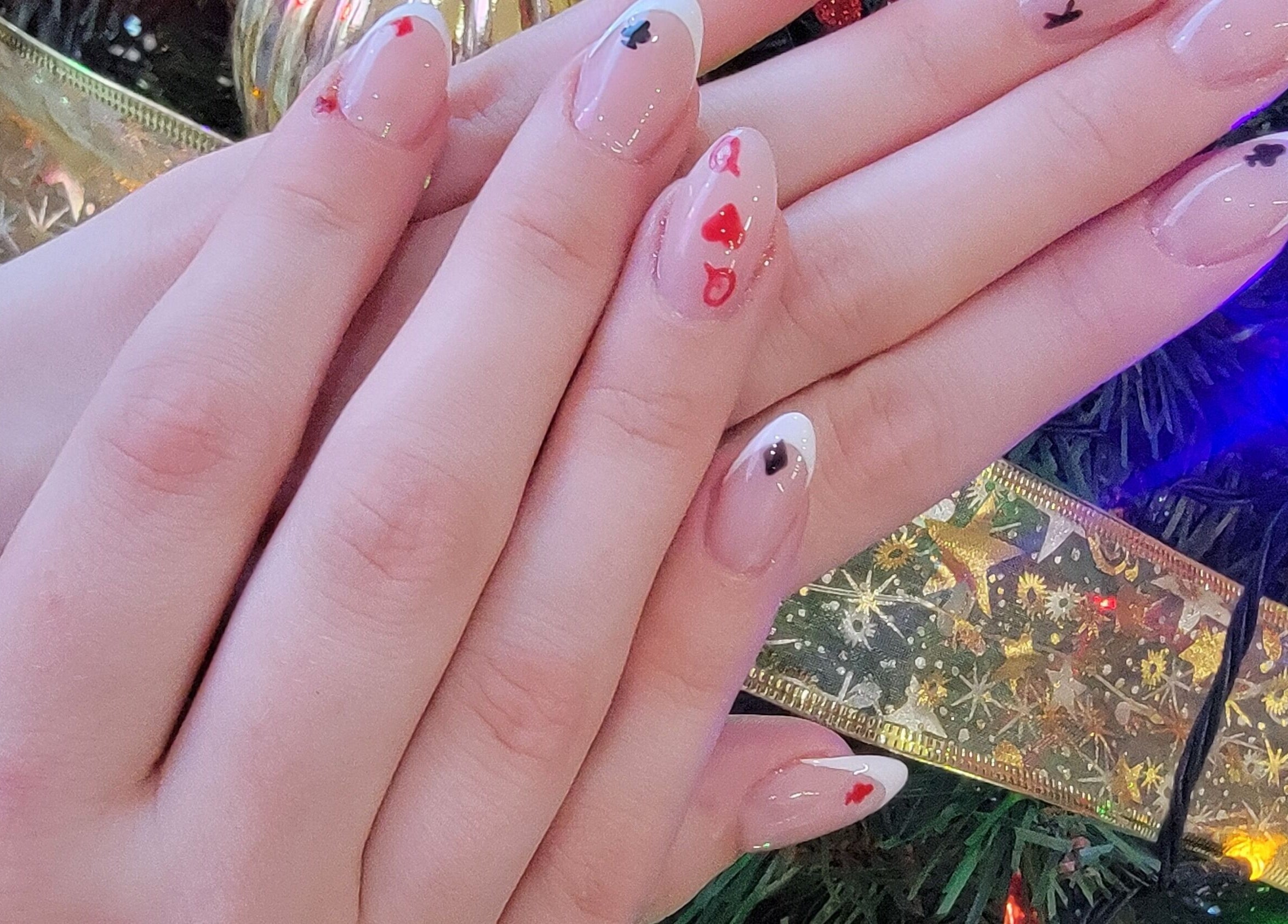 Festive nail art with playing card motifs at Nail Art Bar, Toronto, Ontario, CA.