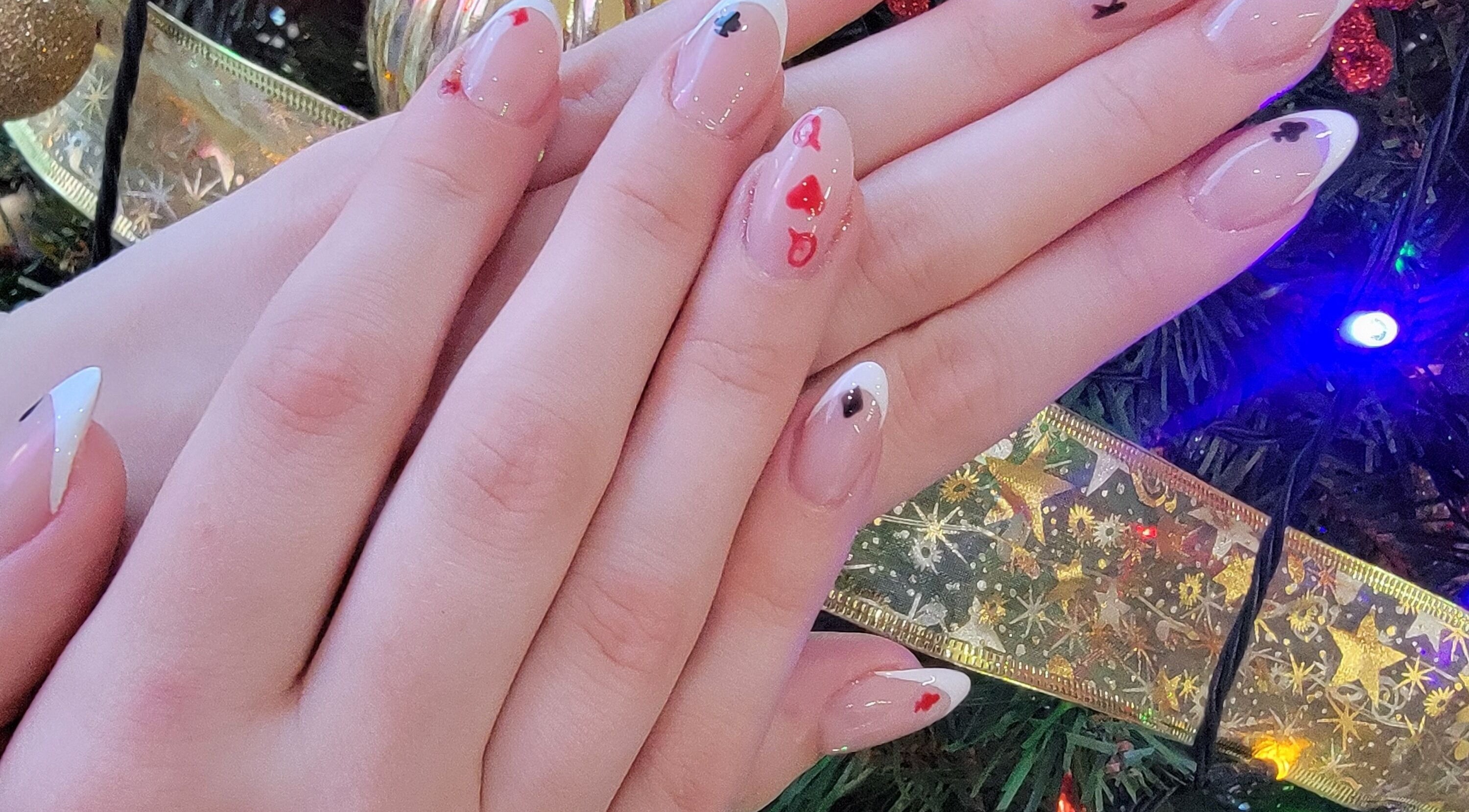 Festive nail art with playing card motifs at Nail Art Bar, Toronto, Ontario, CA.
