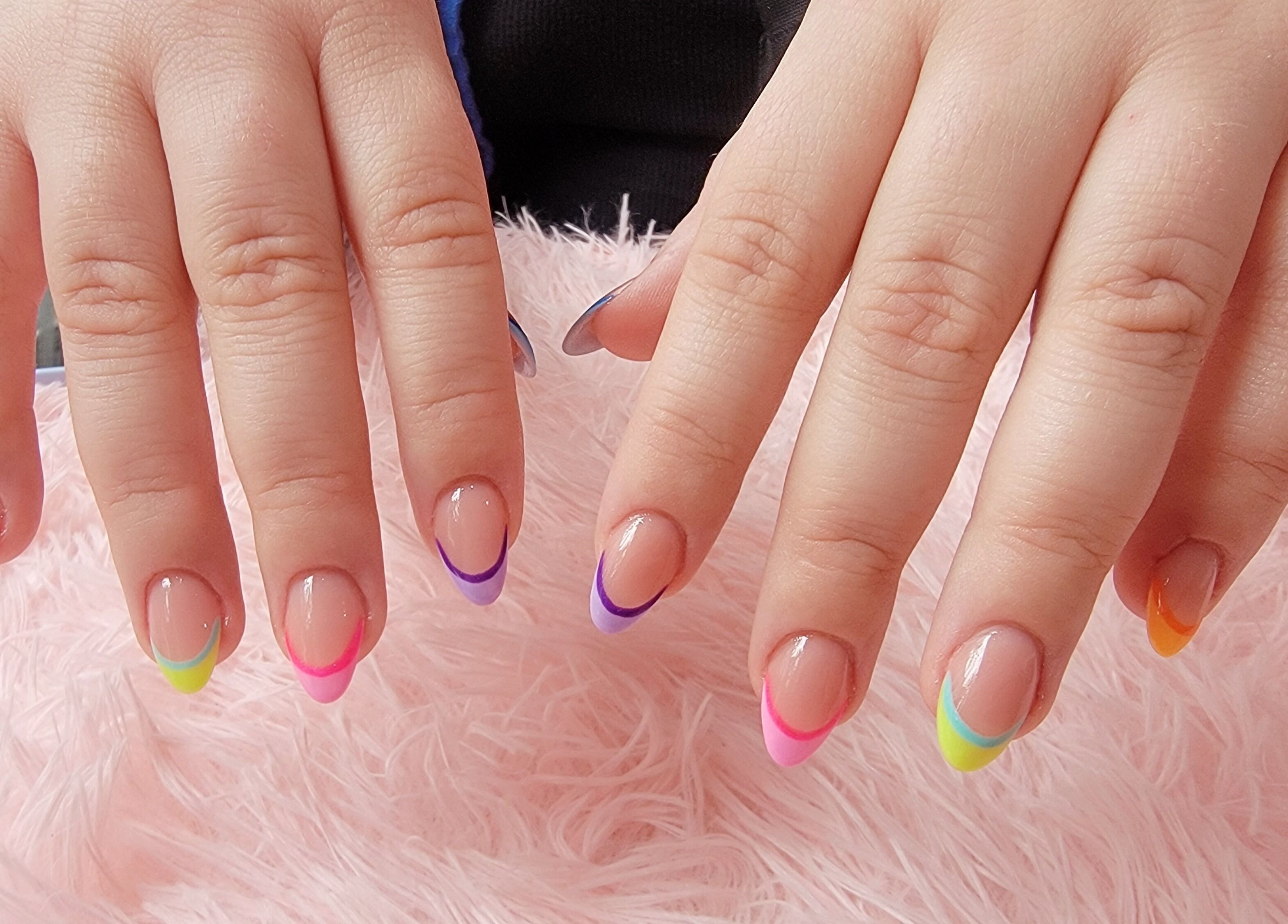 Colorful French nails at Nail Art Bar, Toronto, Ontario, CA. Stylish, vibrant nail designs.