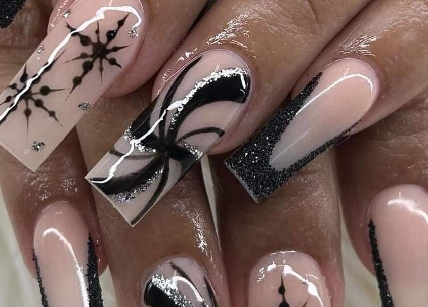 Elegant black and white nail art at Nail Art Bar, Toronto, Ontario, CA. Perfect for a stylish look.