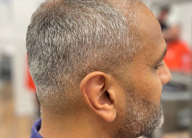 Profile of a man's stylish haircut at Lilliecutss, Brentwood, England, GB.