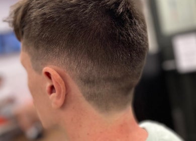 Close-up of a sleek haircut at Lilliecutss, Brentwood, England, GB. Showcasing precision styling.