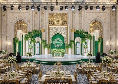 Lavish venue at Qlic Solution Sdn Bhd, Kuala Lumpur, adorned with gold accents and lush greenery for events.