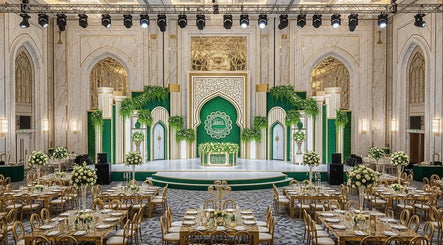 Lavish venue at Qlic Solution Sdn Bhd, Kuala Lumpur, adorned with gold accents and lush greenery for events.