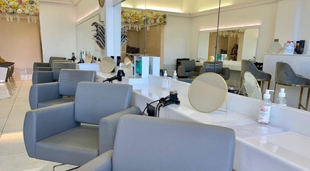 Chic salon interior at Laurens d'Auray, Grays, England, GB with elegant chairs and flower decor.