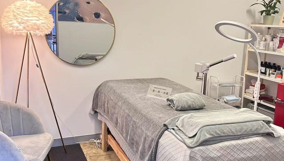 Calming massage room at Aim to be u beauty & massage, Perth, Western Australia, AU with cozy bed and ambient lighting.