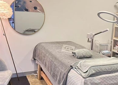 Calming massage room at Aim to be u beauty & massage, Perth, Western Australia, AU with cozy bed and ambient lighting.