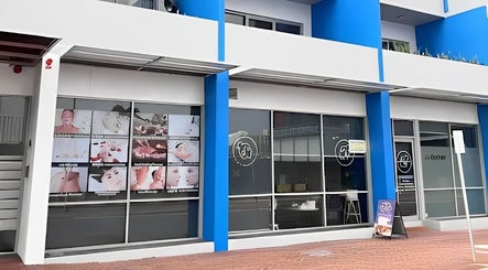 Exterior of Aim to be u beauty & massage in Perth, Western Australia, AU with colorful signage.