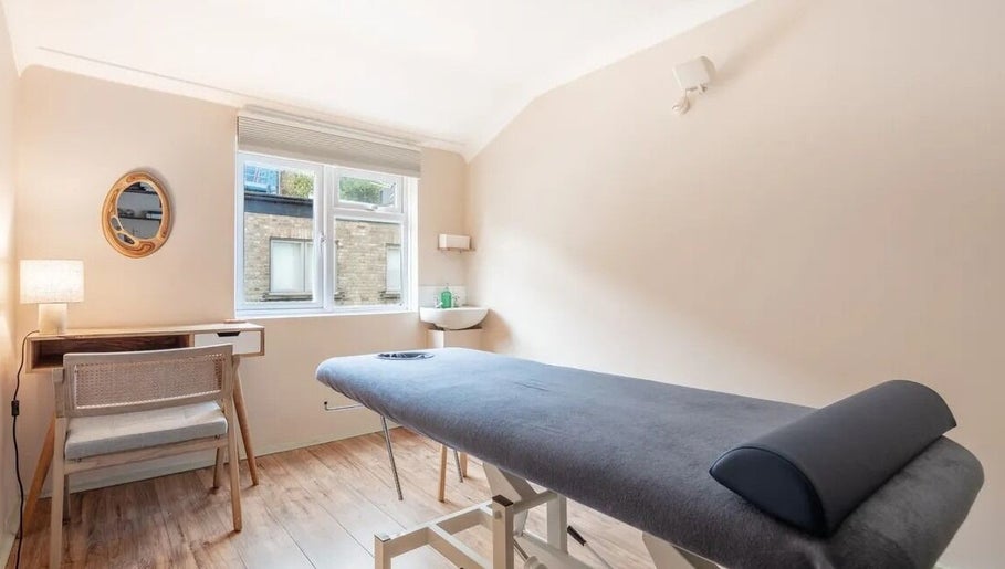 Massage room at SOLUNA Holistic Massage Therapy in London, England, GB featuring a comfortable massage table.