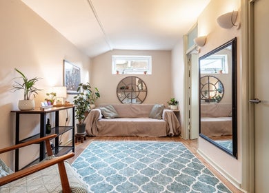 Relaxing seating area at SOLUNA Holistic Massage Therapy, London, England, GB, featuring cozy decor and natural light.