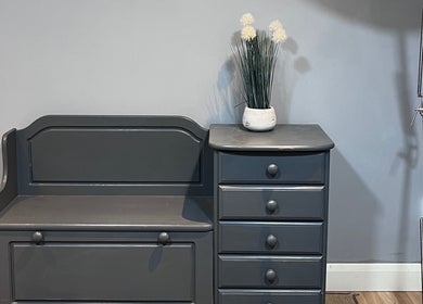 Stylish decor with grey seating and cabinet at Evellere Sugar Waxing, Bromley, England, GB.
