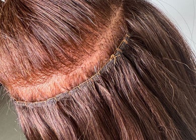 Close-up of expertly applied hair extensions at EM Hair, Seaton Delaval, England, GB.