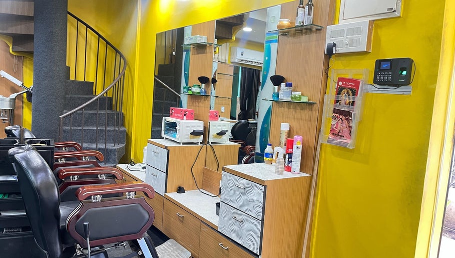 Modern salon chair and vibrant yellow wall at Lubys, Chennai, Tamil Nadu, IN reflecting a stylish ambiance.